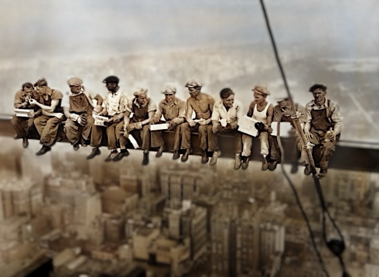 The same photo after Depthly: colorized, with the whole crew tack-sharp on the beam while Manhattan melts into depth-graded blur