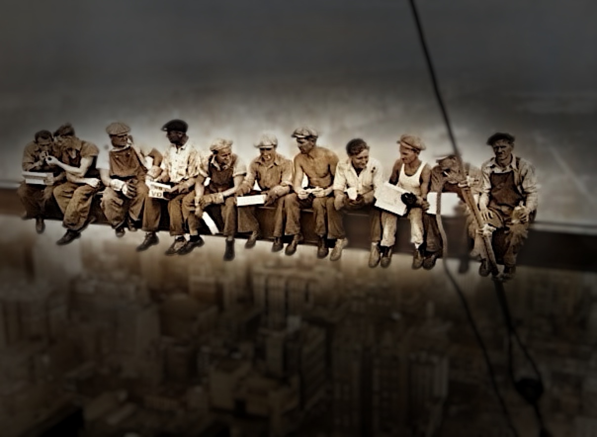 Darken treatment: the blurred city dimmed so the workers pop